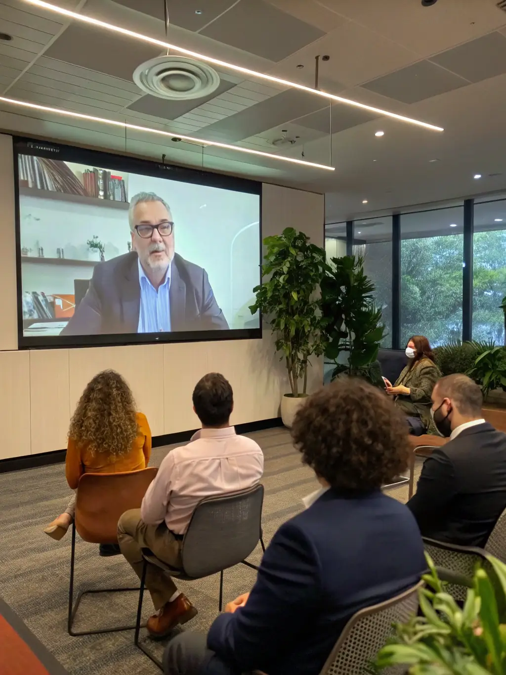 A group of diverse individuals participating in a live Q&A session during a Behestway investment webinar.